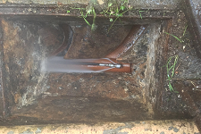 Image of a blocked drain being cleaned